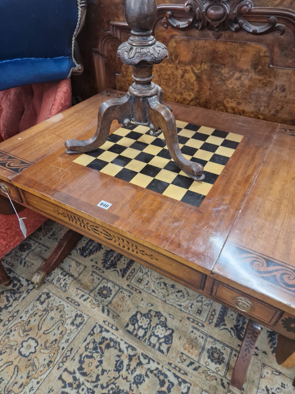 A MAHOGANY FLAP TOP GAMES TABLE DECORATED WITH AN EBONISED SCROLL BAND, THE CENTRE OF THE TOP - Image 3 of 7