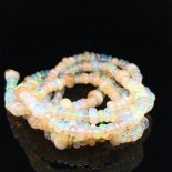 AN OPAL BEADED NECKLACE. VINTAGE OPAL ROUNDEL BEADS RECENTLY RESTRUNG. NECKLACE LENGTH 76cms.