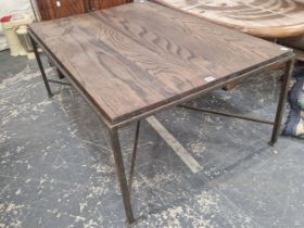 A VINTAGE IRON FRAMED OAK TOPPED COFFEE TABLE.