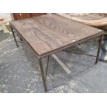 A VINTAGE IRON FRAMED OAK TOPPED COFFEE TABLE.
