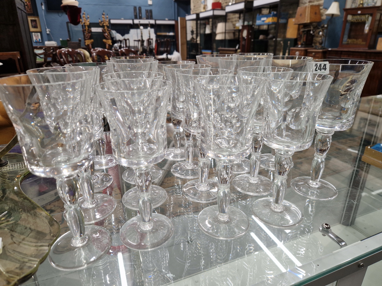 NINETEEN ST LOUIS WINE GLASSES, EACH WITH THE BUCKET BOWL CUT WITH ROUNDELS, THE TWO PART SWOLLEN