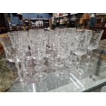 NINETEEN ST LOUIS WINE GLASSES, EACH WITH THE BUCKET BOWL CUT WITH ROUNDELS, THE TWO PART SWOLLEN