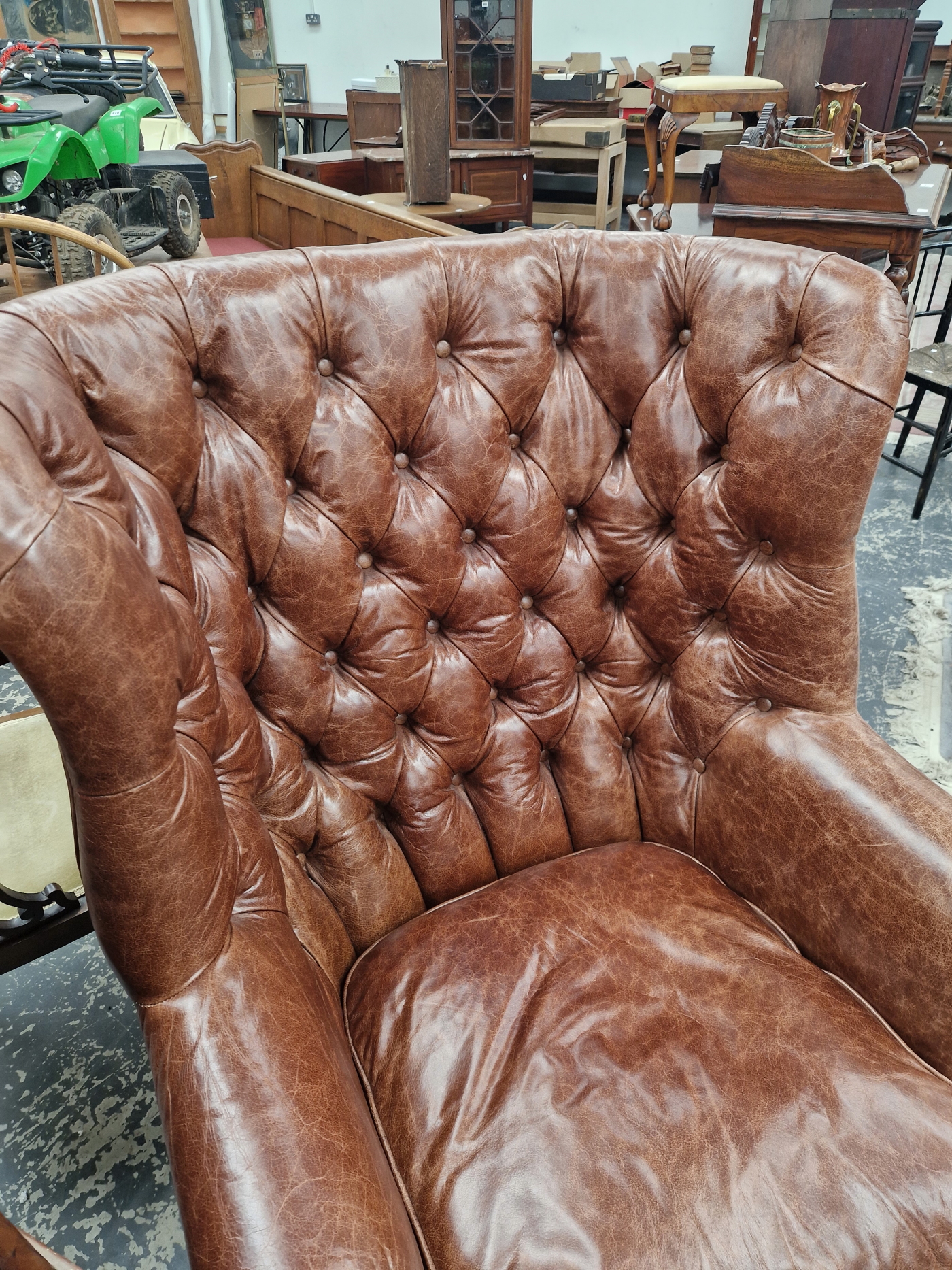A MAHOGANY WING ARMCHAIR BUTTON UPHOLSTERED IN BROWN LEATHERETTE, CLOSE NAILING RUNNING FROM THE - Image 5 of 5