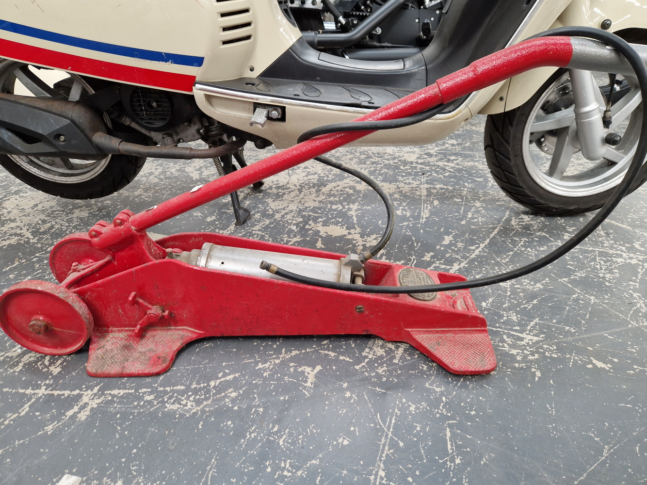 A VINTAGE HAND OPERATED TYRE INFLATION PUMP