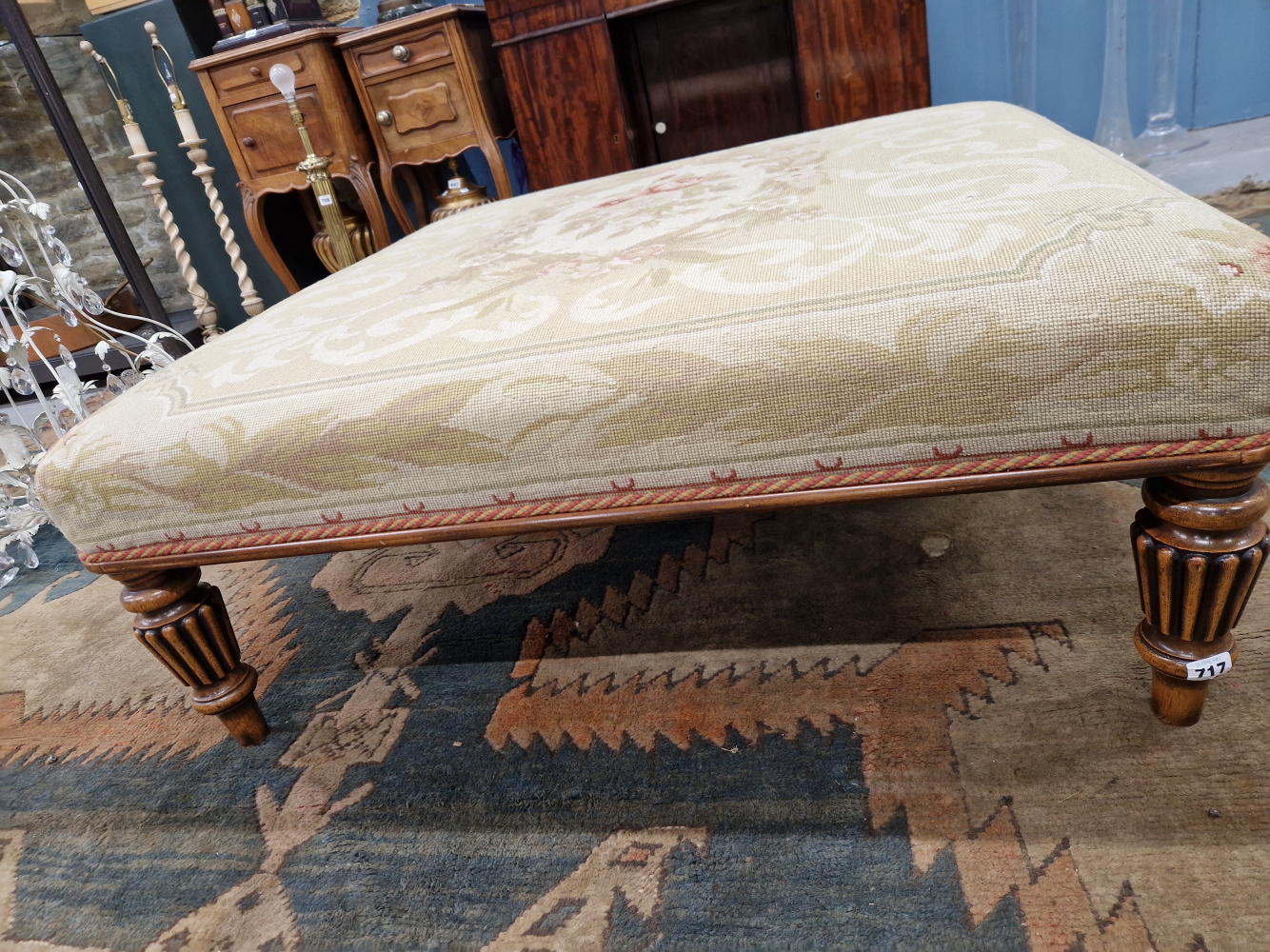A LATE VICTORIAN STYLE MAHOGANY OTTOMAN, THE SQUARE FLORAL NEEDLE WORKED SEAT ON REEDED CYLINDRICAL - Image 2 of 6