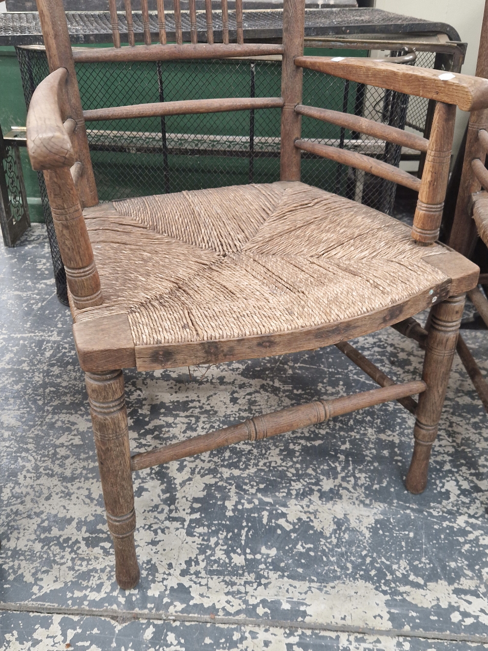 TWO WILLIAM MORRIS STYLE OAK ELBOW CHAIRS WITH RUSH SEATS - Image 2 of 3
