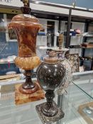 A BROWN ALABASTER COVERED URN SHAPED TABLE LAMP. H 56cms. A SERPENTINE INVERTED BALUSTER TABLE LAMP.