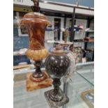 A BROWN ALABASTER COVERED URN SHAPED TABLE LAMP. H 56cms. A SERPENTINE INVERTED BALUSTER TABLE LAMP.