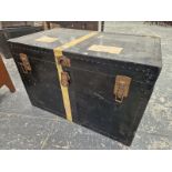 A METAL BOUND BLACK TRUNK WITH TWO LEATHER HANDLES