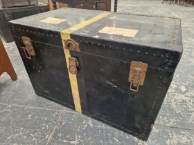 A METAL BOUND BLACK TRUNK WITH TWO LEATHER HANDLES