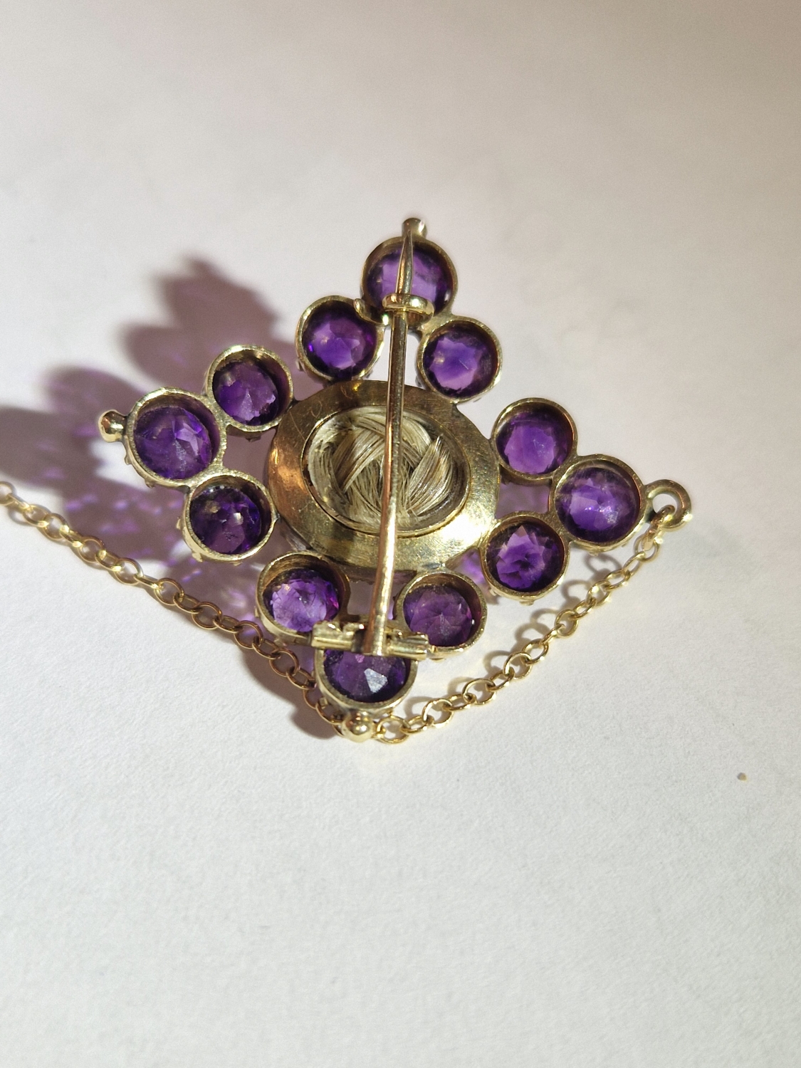 A VICTORIAN MOURNING BROOCH. THE GEMSET AND SEED PEARL BROOCH WITH A GLAZED PANEL TO THE REVERSE - Image 10 of 10
