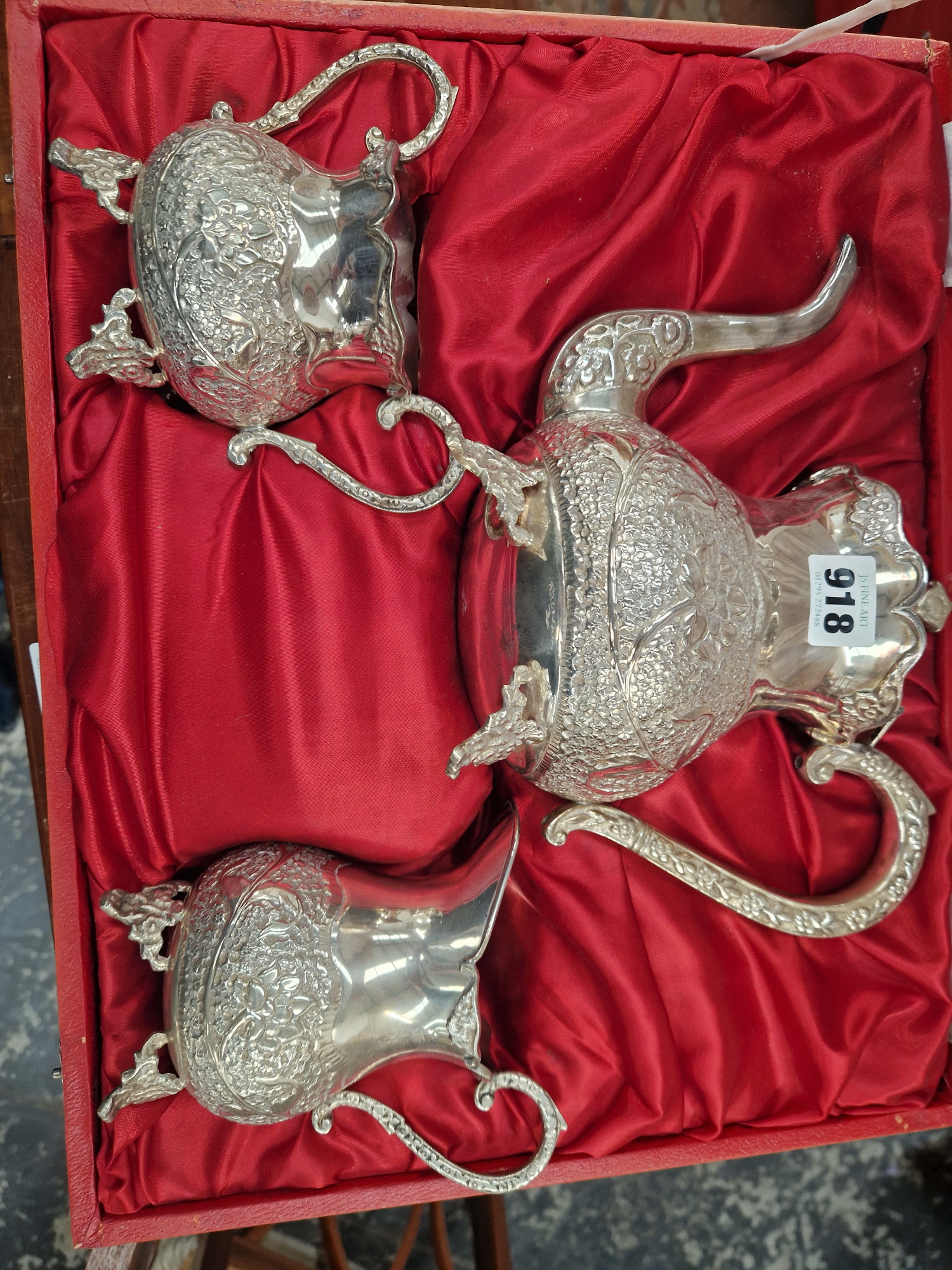 A RED CASED GERMAN SILVER THREE PIECE TEA SET, EACH PIECE CHASED WITH FLOWERS - Image 2 of 6