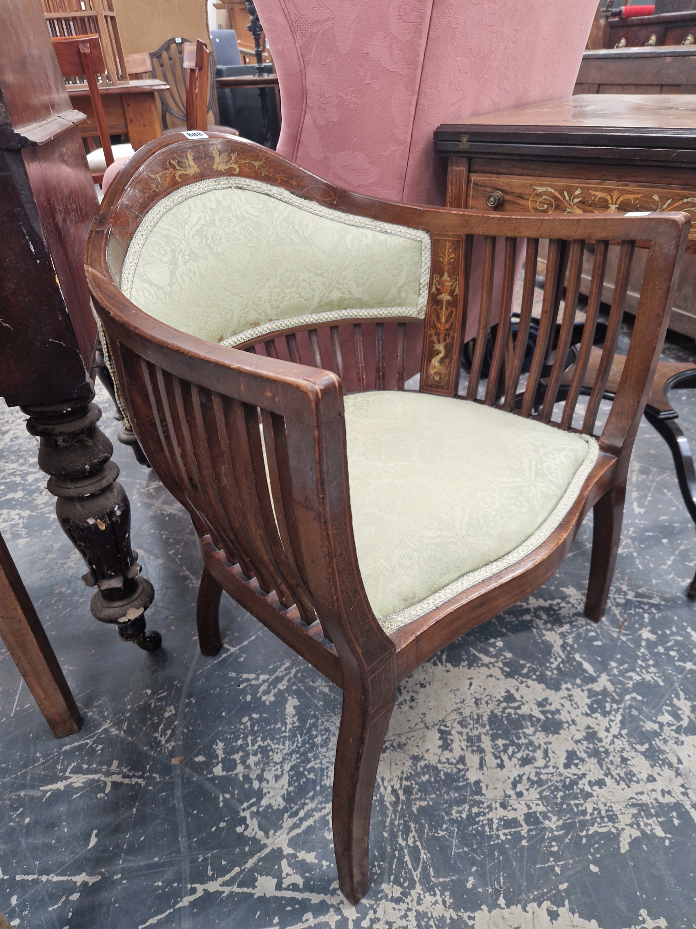 AN EDWARDIAN LINE INLAID MAHOGANY ARMCHAIR, THE ROUNDED PARTIALLY UPHOLSTERED BACK CRESTED BY A PAIR