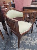 AN EDWARDIAN LINE INLAID MAHOGANY ARMCHAIR, THE ROUNDED PARTIALLY UPHOLSTERED BACK CRESTED BY A PAIR