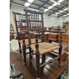 A PAIR OF COUNTRY ELBOW CHAIRS, THE BACKS WITH THREE ROWS OF SPINDLES
