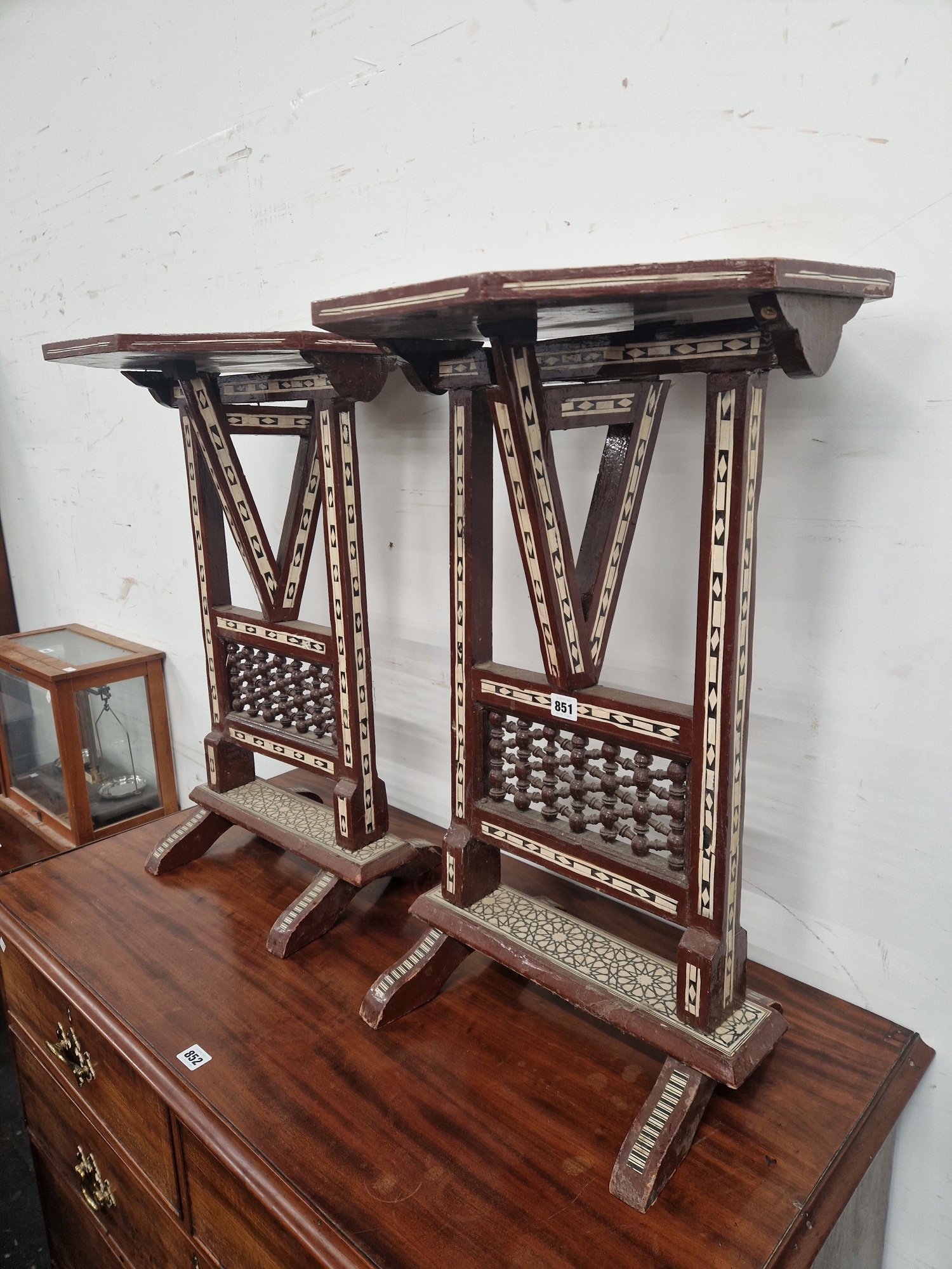 A PAIR OF ISLAMIC FOLDING OCTAGONAL TABLES GEOMETRICALLY INLAID IN MOTHER OF PEARL AND EBONY