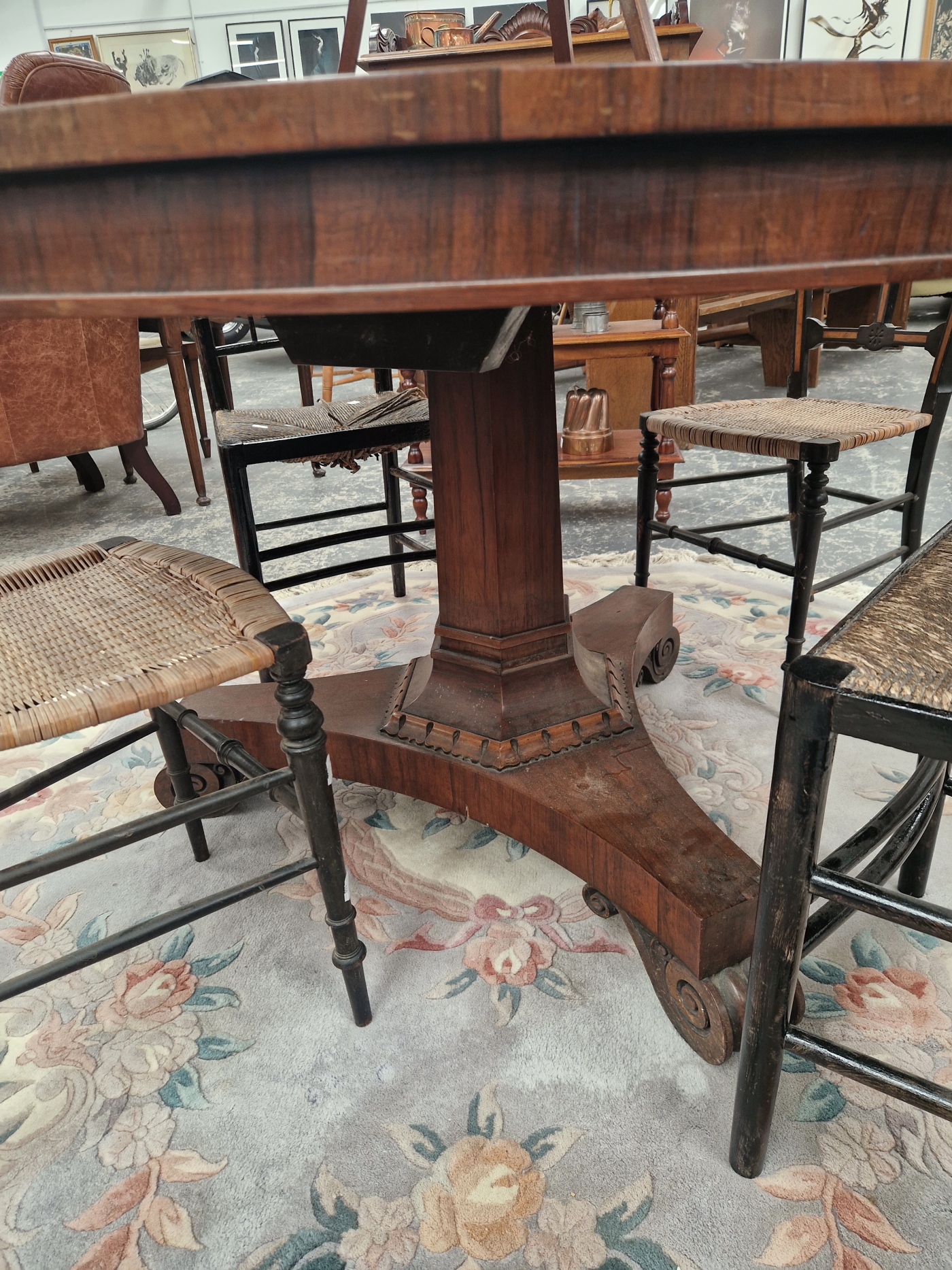 A 19th C. ROSEWOOD BREAKFAST TABLE ON AN OCTAGONAL COLUMN TRIPARTITE PLINTH AND SCROLL FEET. Dia. - Image 2 of 2