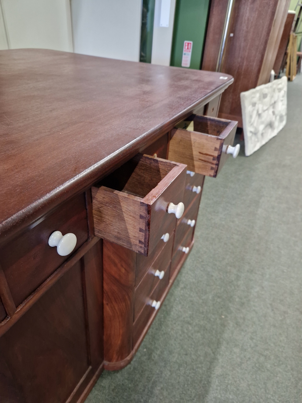 A MAHOGANY SHOP COUNTER FITTED WITH MULTIPLE DRAWERS AND CUPBOARDS EACH WITH WHITE CERAMIC KNOB - Image 8 of 23