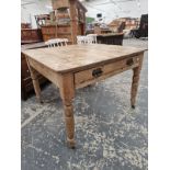 A PINE KITCHEN TABLE WITH A DRAWER TO ONE END OF THE RECTANGULAR TOP, THE TURNED CYLINDRICAL LEGS