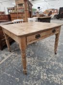 A PINE KITCHEN TABLE WITH A DRAWER TO ONE END OF THE RECTANGULAR TOP, THE TURNED CYLINDRICAL LEGS