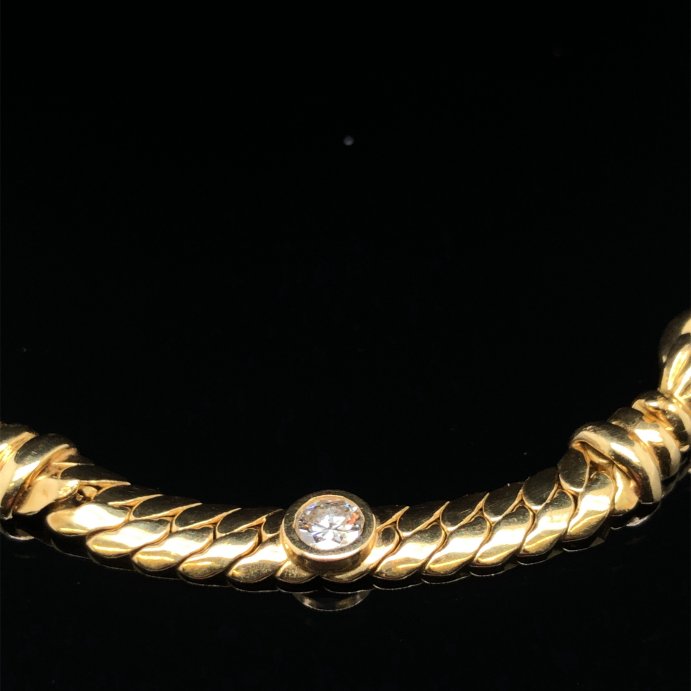 A TRIPLE DIAMOND FLAT S LINK NECKLACE. THE CLASP STAMPED 750, STAR 13 VI, WITH INDISTINCT MAKERS
