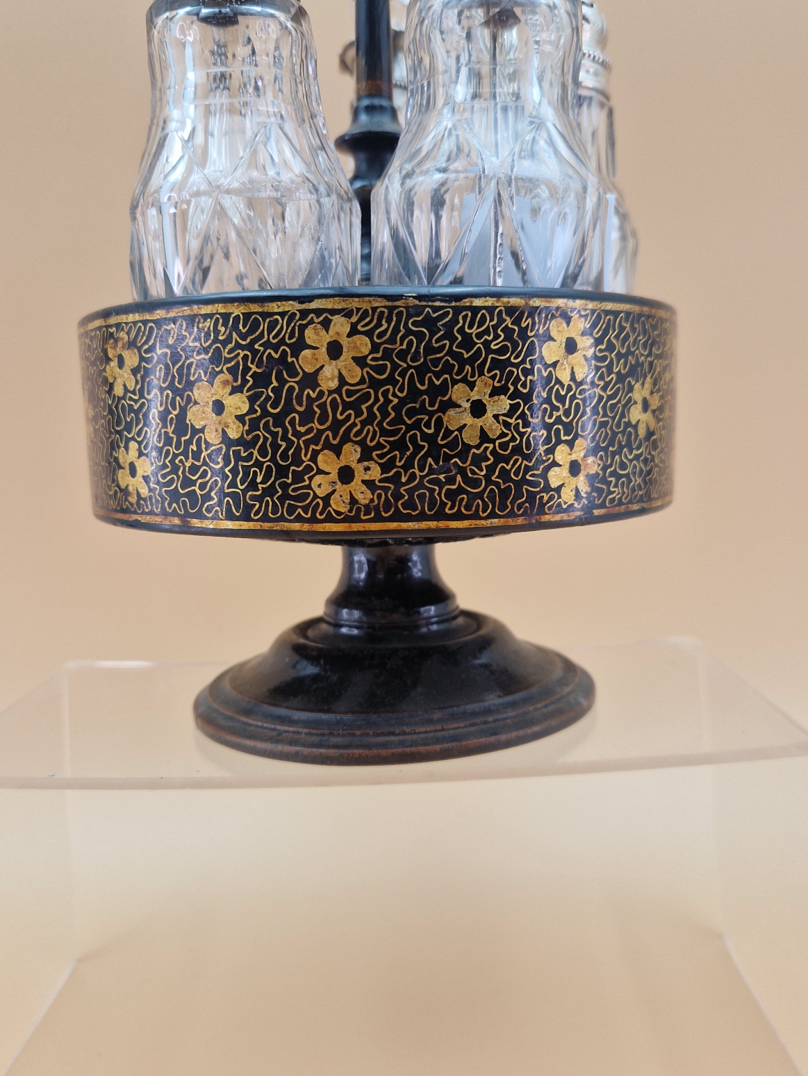 A FLORAL GILT BLACK PAPIER MACHE CRUET STAND WITH FIVE CUT GLASS BOTTLES WITH WHITE METAL MOUNTS, - Image 4 of 8