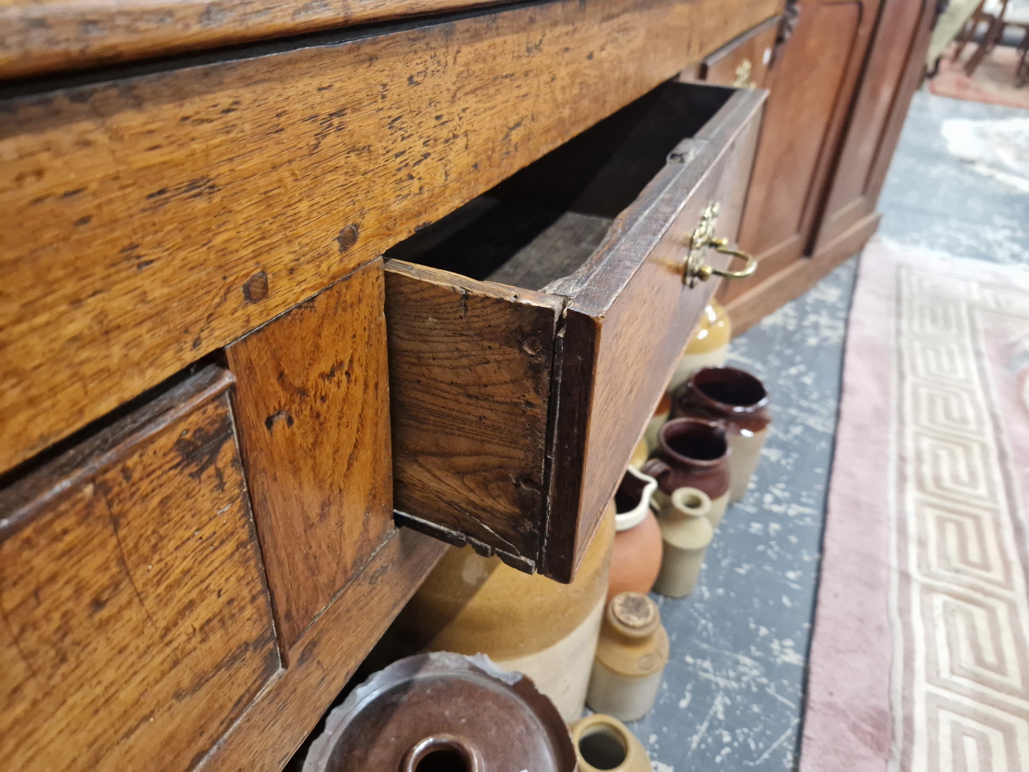 A 19th C. OAK DRESSER BASE WITH THREE DRAWERS ABOVE THE SQUARE SECTIONED LEGS. W 179 x D 46 x H - Image 4 of 7