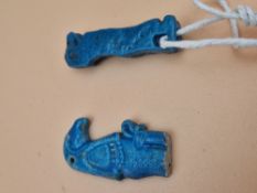 TWO EGYPTIAN BLUE POTTERY PENDANTS REPRESENTING THOTMES AND AMENOPHIS. H 4cms.