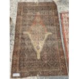 A TURKISH RUG OF CAUCASIAN DESIGN 186 x 109cm, TOGETHER WITH TWO ANTIQUE PERSIAN RUGS AND AN