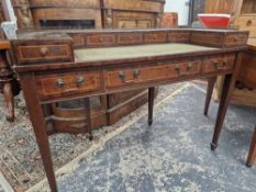 A MAHOGANY CARLTON HOUSE DESK, THE GALLERIED BACK ABOVE FIVE LINE INLAID DRAWERS BEFORE THE GREEN