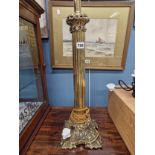 A BRASS FLUTED COLUMN TABLE LAMP SUPPORTED ON A FLORAL QUADRIPARTITE FOOT. H 67cms TOGETHER WITH A