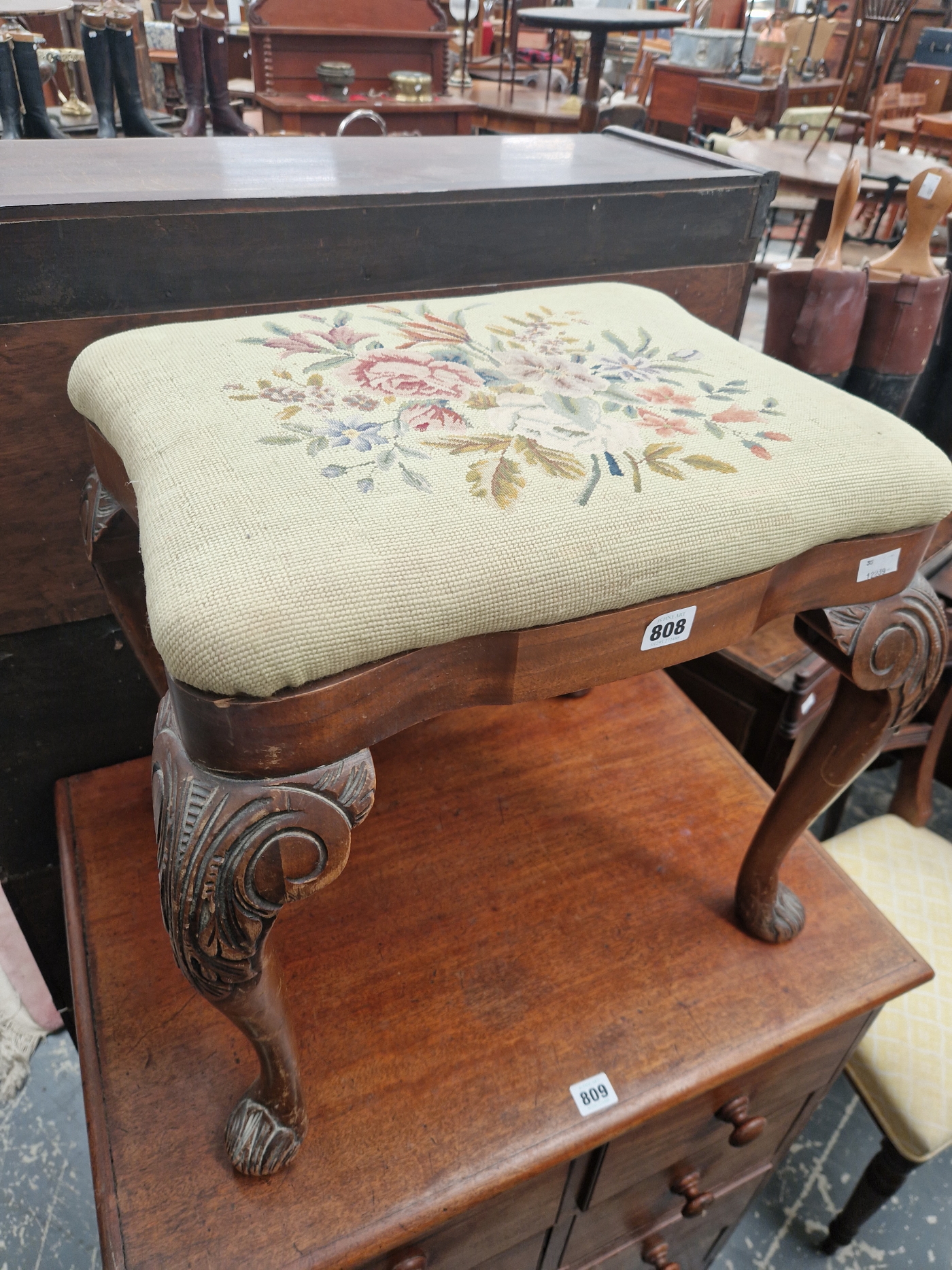 A MAHOGANY STOOL WITH A DROP IN FLORAL NEEDLE WORK SEAT, THE CABRIOLE LEGS CARVED WITH FOLIAGE AT - Image 2 of 3