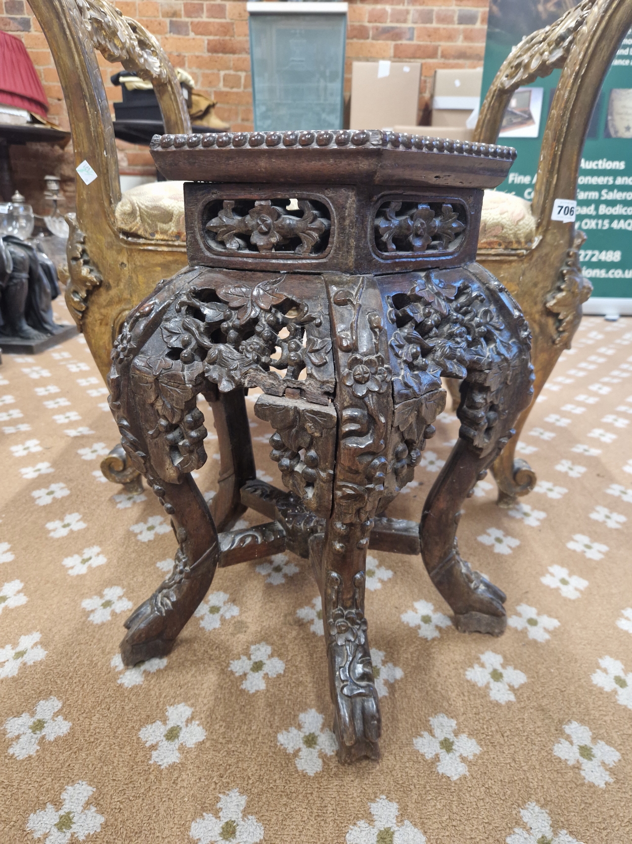 A CHINESE HARDWOOD STAND, THE FIVE SIDED BEAD EDGED TOP INSET WITH A MARBLE ROUNDEL ABOVE PIERCED