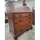 A GEORGE III COUNTRY MADE OAK BUREAU WITH FOUR GRADUATED DRAWERS.