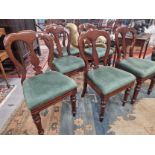 A SET OF SIX LATE VICTORIAN MAHOGANY BALLOON BACKED CHAIRS WITH GREEN DROP IN SEATS TURNED