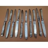 AN ANTIQUE HALLMARKED SILVER DESSERT CUTLERY SET FOR TEN WITH MOTHER OF PEARL HANDLES.