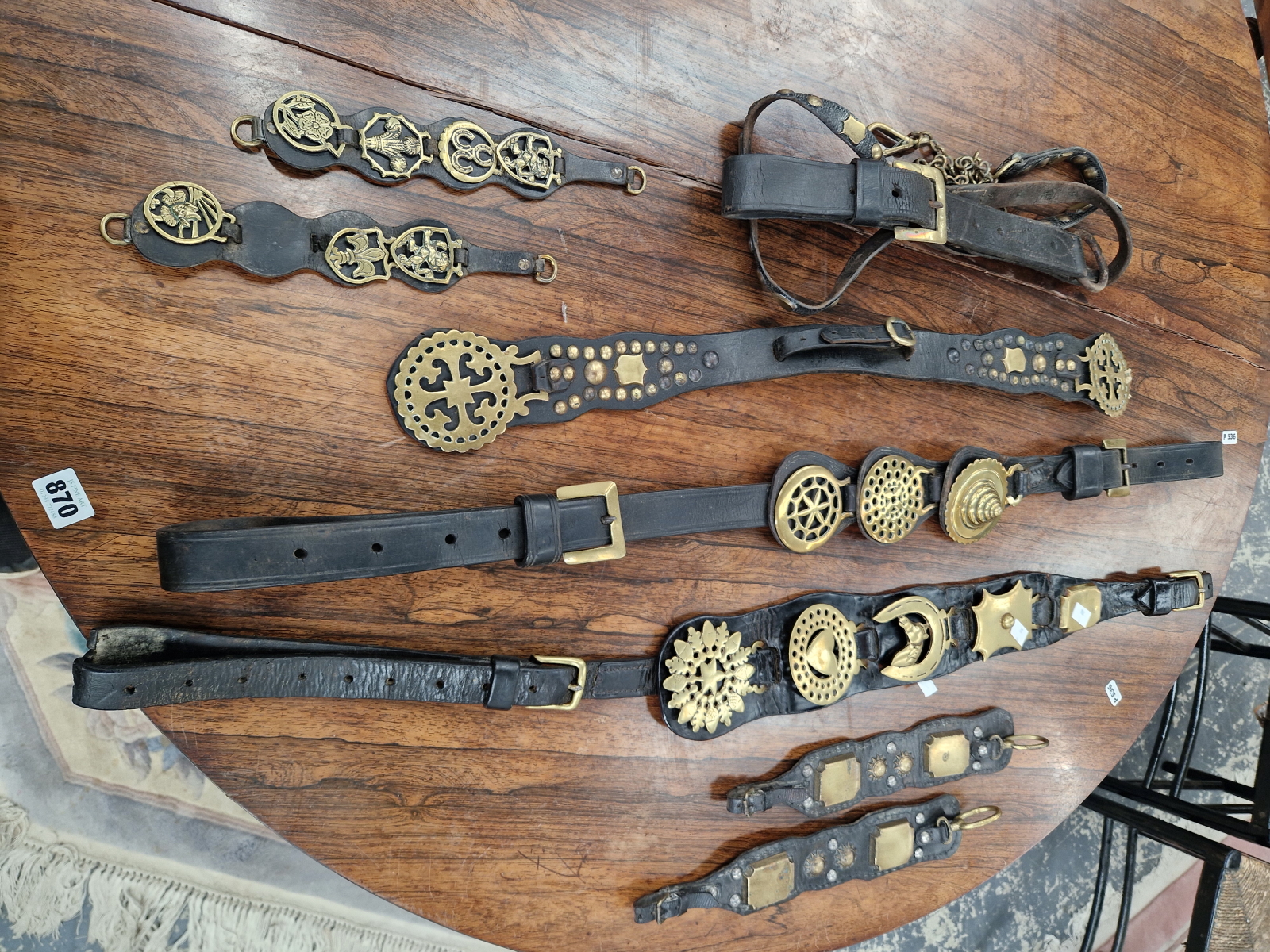 A COLLECTION OF HORSE BRASSES ON LEATHER STRAPS TOGETHER WITH AN AFRICAN TRIBAL STOOL - Image 3 of 6