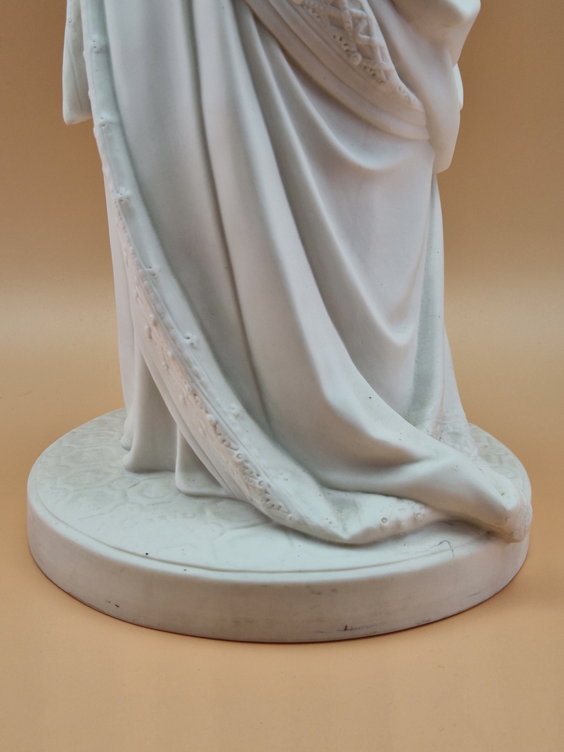 A MINTON PARIAN FIGURE OF A VICTORIAN LADY STANDING ON A CIRCULAR CARPET MOULDED BASE HOLDING UP A - Image 6 of 10