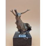 FELIPE GONZALEZ, A CONTEMPORARY BRONZE FIGURE OF A LADY DANCING ON A BLACK STONE PLINTH, HER ARMS