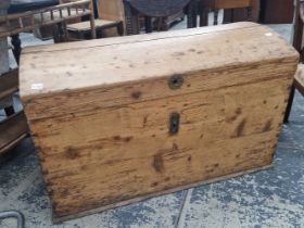 A LARGE ANTIQUE PINE DOME TOP BLANKET CHEST.