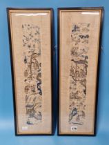 A PAIR OF FRAMED CHINESE SILK SLEEVE PANELS SEWN WITH FIGURES GOING ABOUT VILLAGE PURSUITS ON