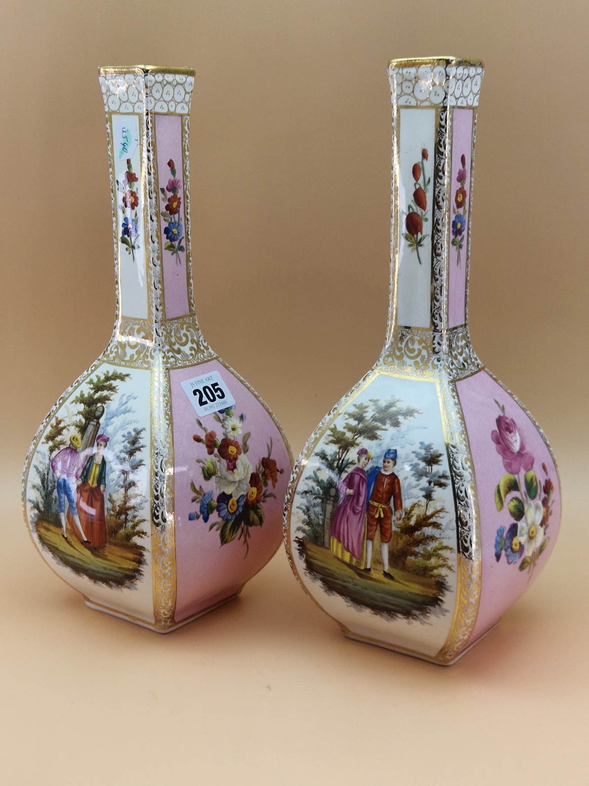 A PAIR OF DRESDEN SQUARE SECTION BOTTLE VASES, PAINTED WITH PINK GROUND FLORAL PANELS ALTERNATING
