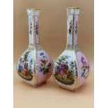 A PAIR OF DRESDEN SQUARE SECTION BOTTLE VASES, PAINTED WITH PINK GROUND FLORAL PANELS ALTERNATING