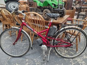 A LADYS RED BATTERY POWERED YAMAHA BICYCLE