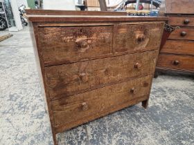 AN ARTS AND CRAFTS PERIOD PINE CHEST OF TWO SHORT & TWO LONG DRAWERS.