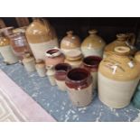 A COLLECTION OF VINTAGE POTTERY FLAGONS AND BARRELS