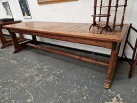 A TEAK AND PINE REFECTORY TABLE, THE CLEATED RECTANGULAR PLANK TOP ON PAIRS OF LEGS TO EACH NARROW