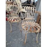 A PAIR OF ANTIQUE FRENCH IRON SPRUNG SEAT CAFE TYPE CHAIRS DESIGNED BY FRANCOIS CARRE LABELLED