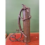 AN INTERESTING WWI TRENCH ART SHELL CASE STICK STAND SUPPORTED BY A HAND WROUGHT IRON SINUOUS