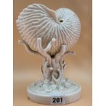 A LATE 19th C. BELLEEK PORCELAIN NAUTILUS SHELL RAISED ON A CORAL COLUMN FROM A SHELL STREWN